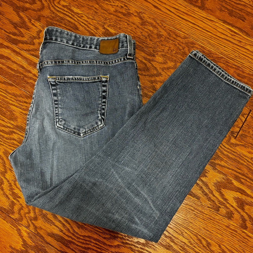 Ag denim pants size 33R women’s. Ripped knees. Straight leg. Previously owned.
